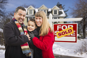 Image showing Family in Front of Sold Real Estate Sign and House