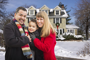 Image showing Mixed Race Family in Front of House in The Snow
