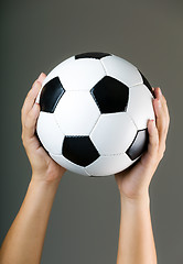 Image showing Hand holding soccer ball