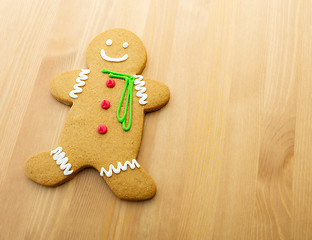 Image showing Gingerbread man on wooden background