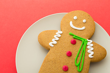 Image showing Gingerbread man on red background