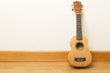 Image showing Ukuele on the floor