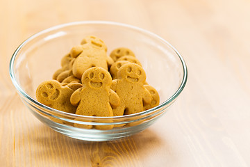 Image showing Gingerbread men cookies in transparent bowl