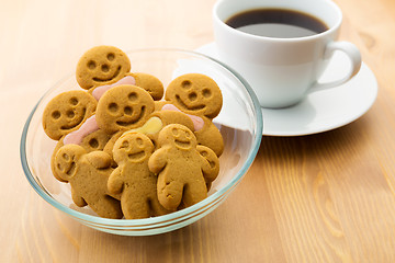 Image showing Gingerbread man with coffee