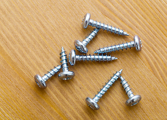 Image showing screws on wood