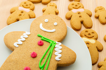 Image showing Traditional gingerbread cookies on wooden background