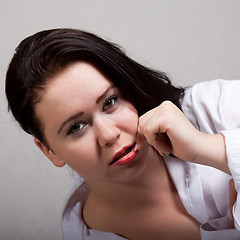 Image showing Portrait of long-haired woman in a white men's shirt