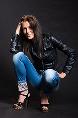 Image showing Long-haired woman in a leather jacket