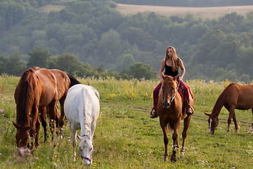 Image showing Young girl with a horse