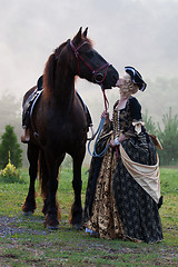 Image showing Woman in dress royal baroque riding