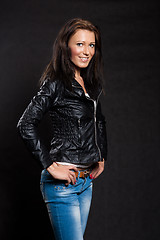 Image showing Long-haired woman in a leather jacket