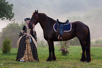 Image showing Woman in dress royal baroque riding