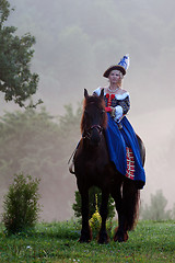 Image showing Woman in dress royal baroque riding