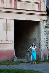 Image showing Retro girl on old bike