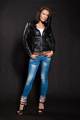 Image showing Long-haired woman in a leather jacket