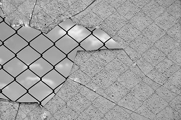 Image showing broken glass and wired fence