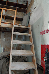 Image showing crumbling attic and wooden stairs