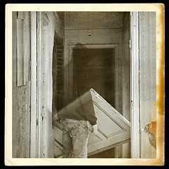 Image showing vintage photo of ghost in haunted hallway