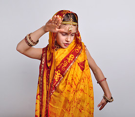 Image showing child in traditional Indian clothing and jeweleries dancing