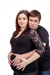 Image showing loving happy couple, pregnant woman with her husband, isolated o
