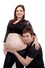 Image showing loving happy couple, smiling pregnant woman with her husband