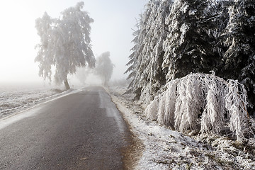 Image showing winter Road going in to the fog