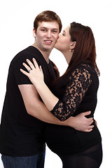 Image showing loving happy couple, woman kissing her husband