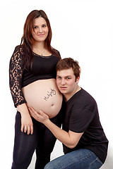 Image showing loving happy couple, smiling pregnant woman with her husband