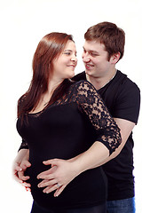 Image showing loving happy couple, smiling pregnant woman with her husband