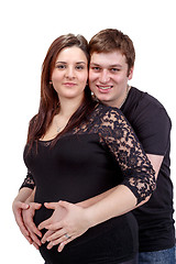 Image showing loving happy couple, pregnant woman with her husband, isolated o