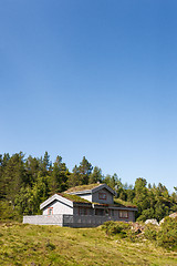 Image showing Typical norwegian building with grass on the roof