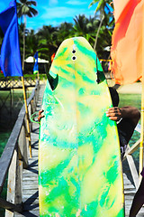 Image showing Surfer with surfboard