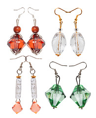 Image showing Earrings made of plastic and glass on a white background. Four p