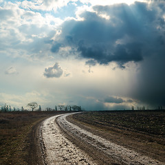 Image showing dirty road to dramatic sky