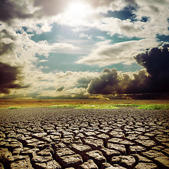 Image showing hot sun over drought earth with cracks