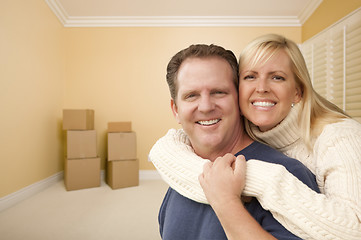 Image showing Happy Affectionate Couple in Room of New House with Boxes