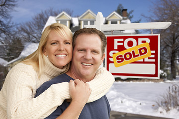 Image showing Couple in Front of New House and Real Estate Sign