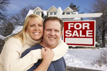 Image showing Couple in Front of New House and Real Estate Sign