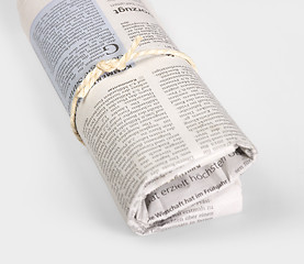 Image showing rolled newspaper