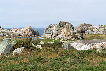 Image showing house between rock formation