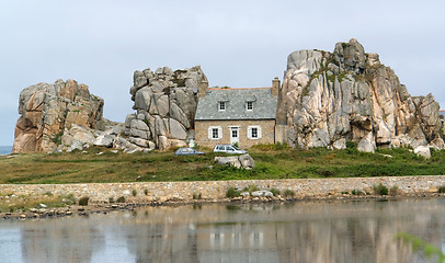 Image showing house between rock formation