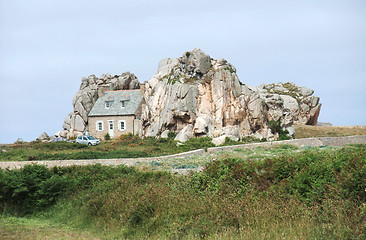 Image showing house between rock formation