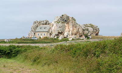Image showing house between rock formation