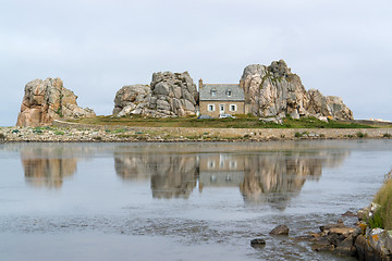 Image showing house between rock formation