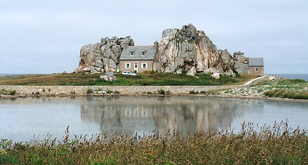 Image showing house between rock formation