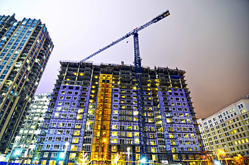 Image showing tall highrise building under construction in a big city