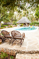 Image showing Chairs on swimming pool border