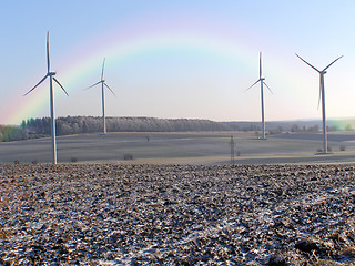 Image showing wind wheels with rainbow