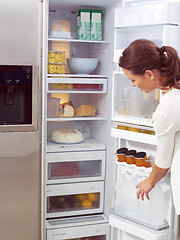 Image showing woman looking for something to eat