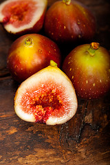 Image showing fresh figs over old wood